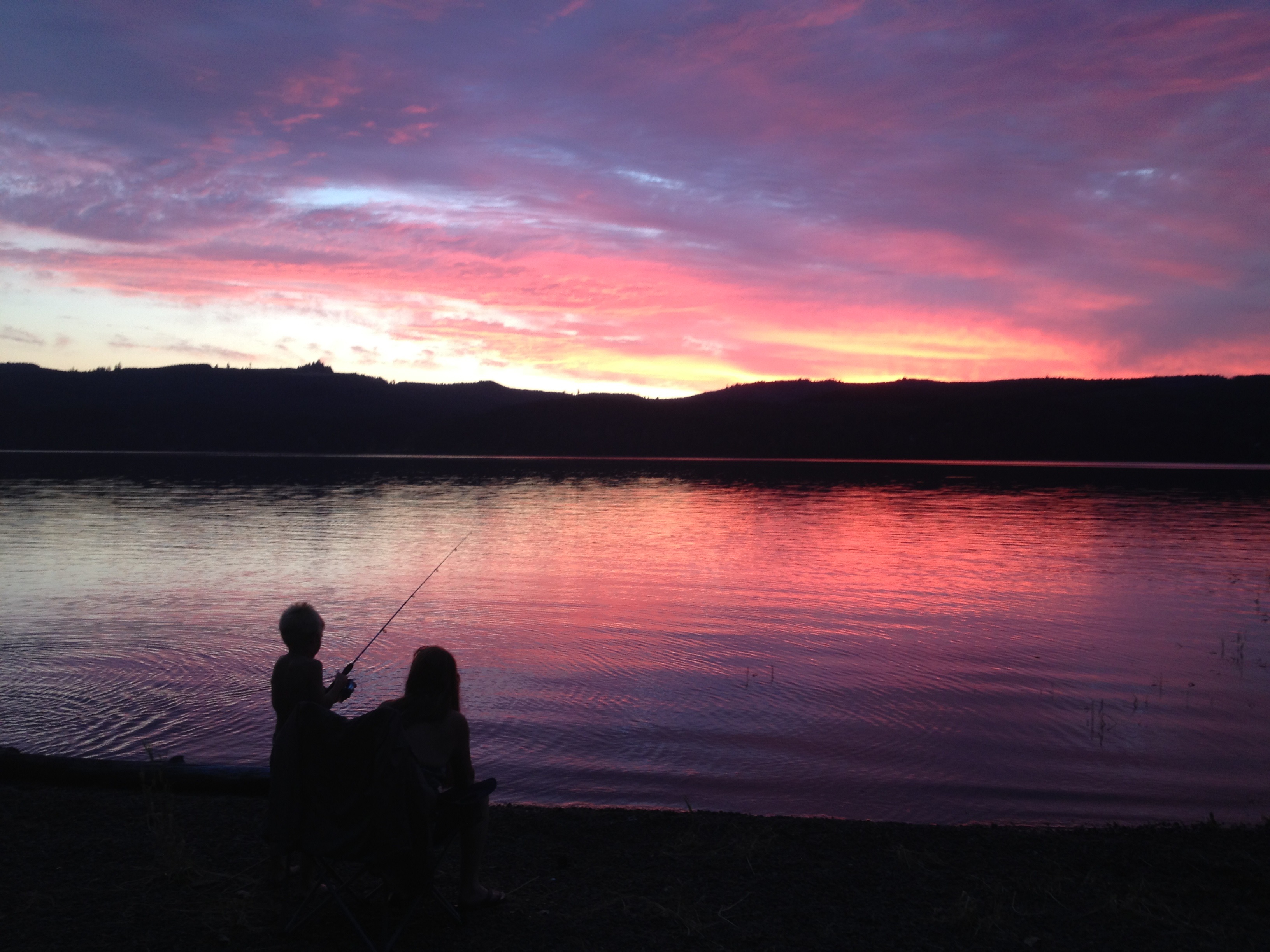 A family recreates at Cottage Grove Reservoir, southeast of Eugene, Ore., during sunset, July 10, 2014